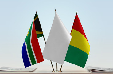 Flags of Republic of South Africa and Guinea with a white flag in the middle