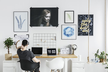Man in white home office