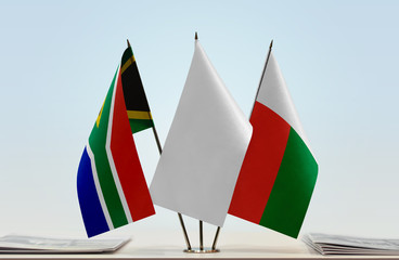 Flags of Republic of South Africa and Madagascar with a white flag in the middle