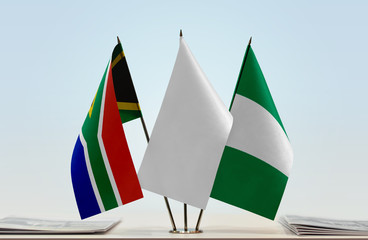 Flags of Republic of South Africa and Nigeria with a white flag in the middle