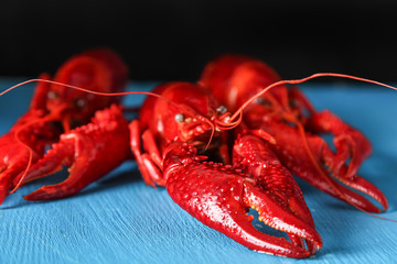 Delicious boiled crayfish close-up. Dark background. Dinner with seafood.