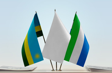 Flags of Rwanda and Sierra Leone with a white flag in the middle