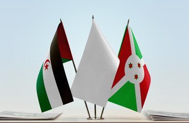 Flags of Sahrawi Arab Democratic Republic and Burundi with a white flag in the middle