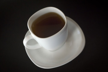 Hot drink cup on black background.