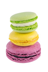 macaron cookie green apple, on a purple berry in the middle of a yellow lemon, on a white background