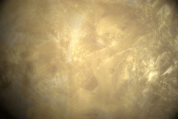 golden background primed on a wall