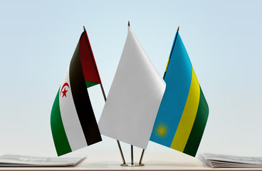 Flags of Sahrawi Arab Democratic Republic and Rwanda with a white flag in the middle