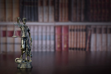 Law and Justice concept. Law books on background