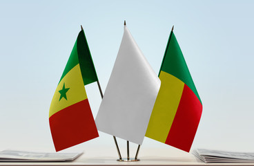 Flags of Senegal and Benin with a white flag in the middle