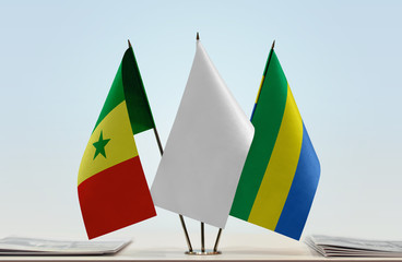 Flags of Senegal and Gabon with a white flag in the middle
