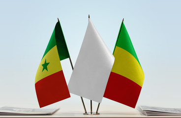 Flags of Senegal and Mali with a white flag in the middle