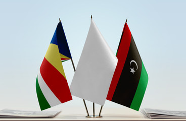 Flags of Seychelles and Libya with a white flag in the middle