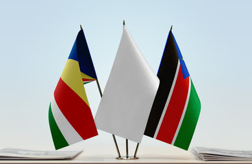 Flags of Seychelles and South Sudan with a white flag in the middle
