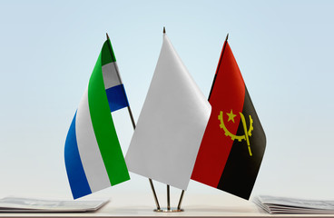 Flags of Sierra Leone and Angola with a white flag in the middle