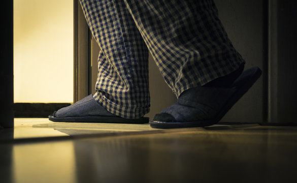 Adult Man In Pijamas Walks To A Bathroom At The Night. Men's Healths Concept