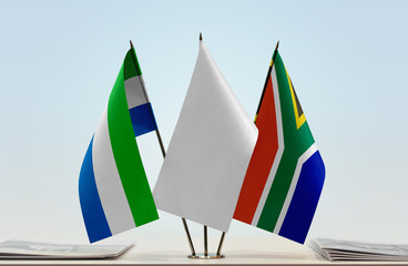 Flags of Sierra Leone and Republic of South Africa with a white flag in the middle