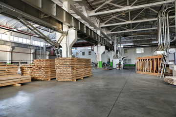 Warehouse of lumber at the woodworking plant. Shop woodworking plant