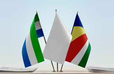 Flags of Sierra Leone and Seychelles with a white flag in the middle