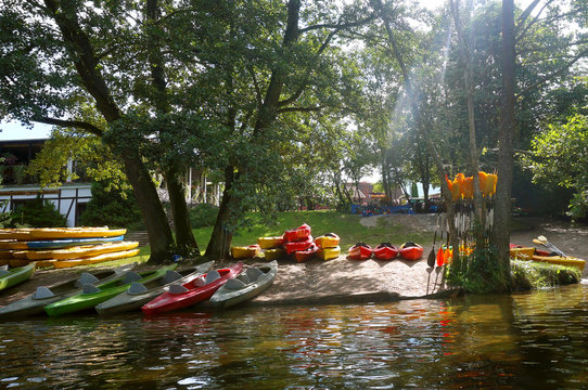 Tourist base of kayaks and canoes. Summer adventure kayak. Rafting to canoe.