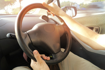 Left-handed catch on the bottom and the right hand grip on the top of the steering wheel.