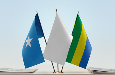 Flags of Somalia and Gabon with a white flag in the middle