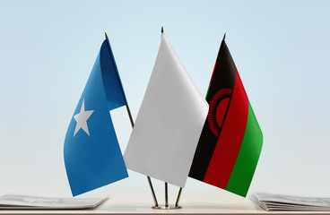 Flags of Somalia and Malawi with a white flag in the middle