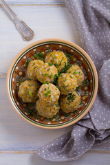 Beef meatballs with rice, onion and carrot in broth. View from above, top, vertical