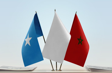 Flags of Somalia and Morocco with a white flag in the middle