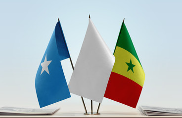 Flags of Somalia and Senegal with a white flag in the middle