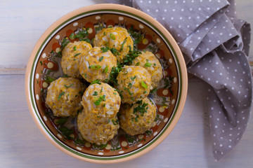 Beef meatballs with rice, onion and carrot in broth. View from above, top, horizontal