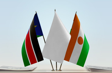 Flags of South Sudan and Niger with a white flag in the middle