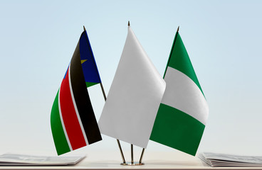 Flags of South Sudan and Nigeria with a white flag in the middle