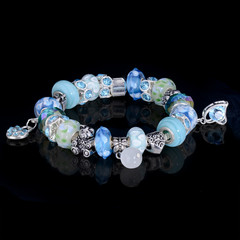 jewelry bracelet female glass crystal elements black background beautiful elegant multicolored handwork chain reflection