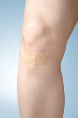 Plaster on female leg