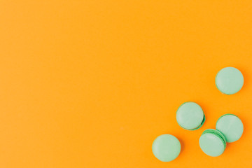 top view of macarons isolated on orange