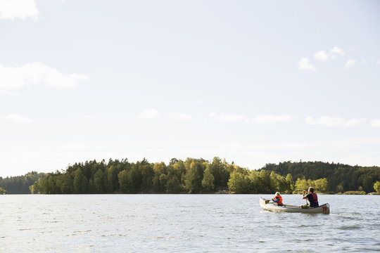 Man in canoe with his daughter in Delsjon, Sweden