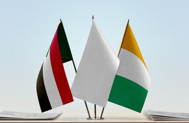 Flags of Sudan and Ivory Coast with a white flag in the middle