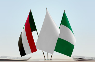 Flags of Sudan and Nigeria with a white flag in the middle