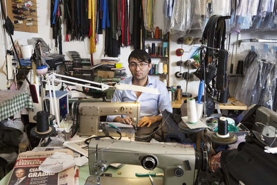 Man at sewing station