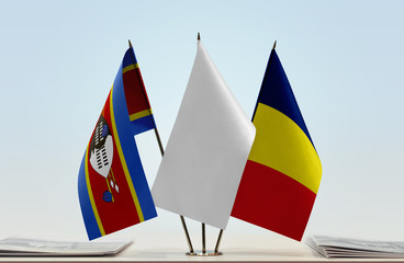 Flags of Swaziland and Chad with a white flag in the middle