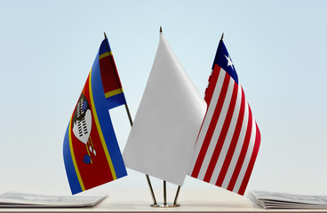 Flags of Swaziland and Liberia with a white flag in the middle