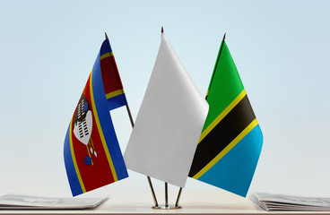 Flags of Swaziland and Tanzania with a white flag in the middle