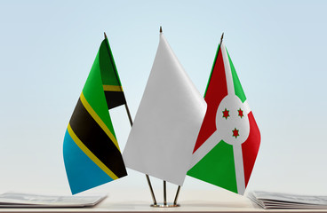 Flags of Tanzania and Burundi with a white flag in the middle