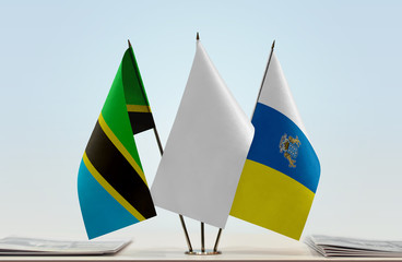 Flags of Tanzania and Canary Islands with a white flag in the middle