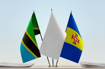 Flags of Tanzania and Madeira with a white flag in the middle