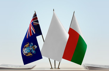 Flags of Tristan da Cunha and Madagascar with a white flag in the middle