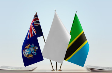 Flags of Tristan da Cunha and Tanzania with a white flag in the middle