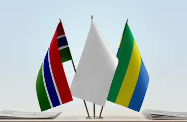 Flags of The Gambia and Gabon with a white flag in the middle