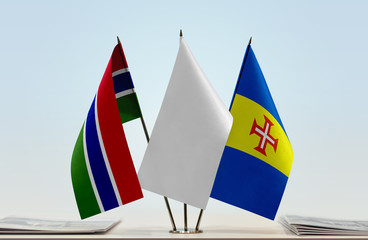 Flags of The Gambia and Madeira with a white flag in the middle