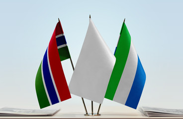 Flags of The Gambia and Sierra Leone with a white flag in the middle